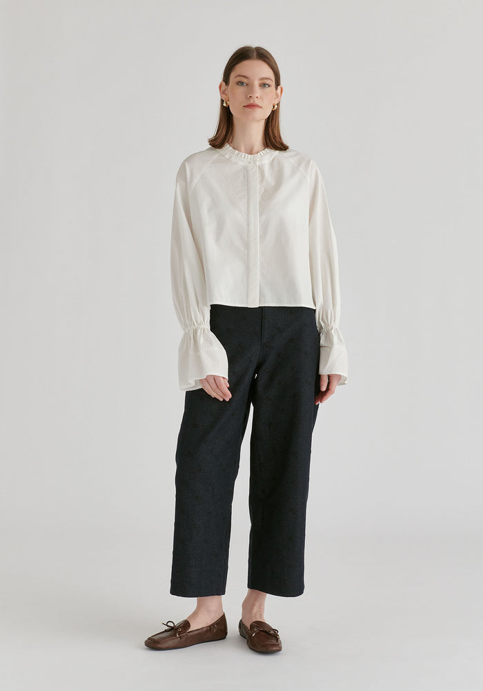 Ruffle Round Neck Blouse with Cinch Wrist Detail in White Front