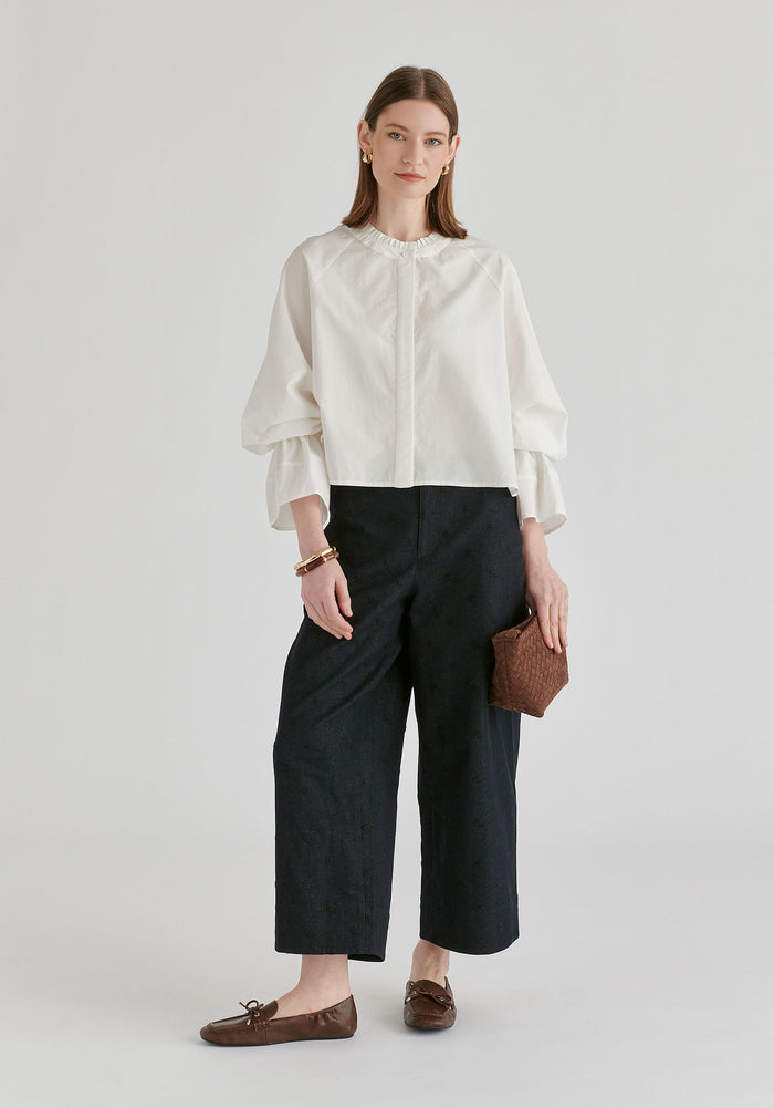 Ruffle Round Neck Blouse with Cinch Wrist Detail in White  Front