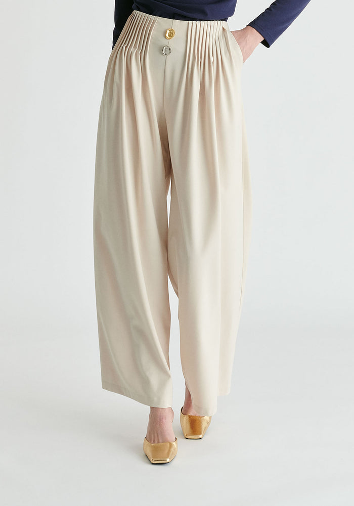Wide Leg Trousers with Pleated Waist Detail in Cream Closeup